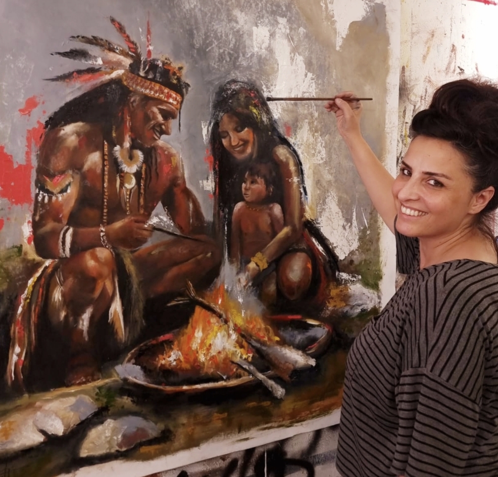 Galit Cohen in her studio, painting Circle of Fire